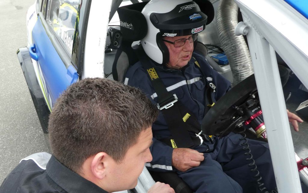 Jordan Michels talking to Barry Keen in race car