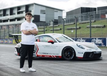 Ryan Wood standing in front of Porsche Carrera Cup car