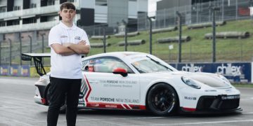 Ryan Wood standing in front of Porsche Carrera Cup car
