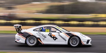 Porsche 991 Cup Car side view racing on track