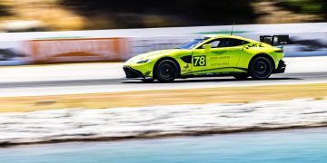 Aston Martin Vantage GT4 racing on track side view
