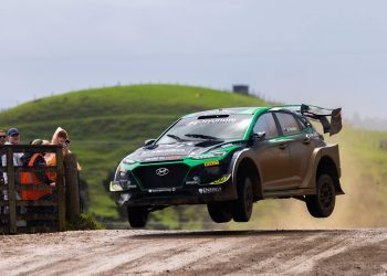 Hayden Paddon jumping Hyundai Kona EV rally car