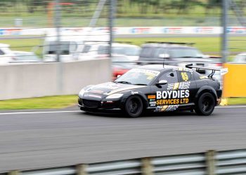 Mazda RX8 race car racing on track with flaming exhaust
