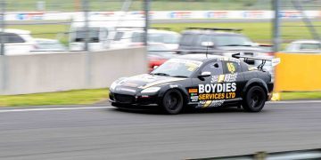 Mazda RX8 race car racing on track with flaming exhaust