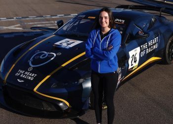 Rianna O'Meara Hunt standing next to The Heart of Racing's Aston Martin GT4