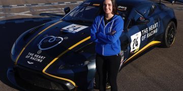 Rianna O'Meara Hunt standing next to The Heart of Racing's Aston Martin GT4