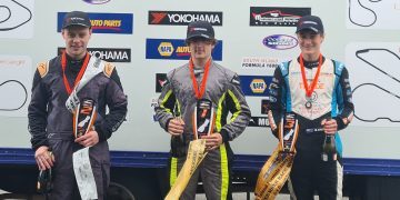 Alex Crosbie standing on podium in third round of South Island F1600 Championship