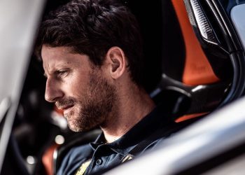 Romain Grosjean sitting in race car