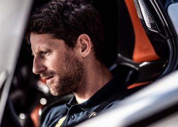 Romain Grosjean sitting in race car