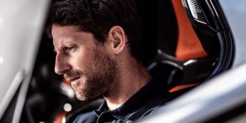 Romain Grosjean sitting in race car