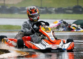 Liam Lawson racing go kart in wet conditions