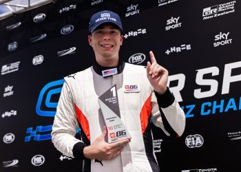 Brock Gilchrist holding up first place trophy at Teretonga Park Raceway