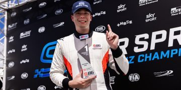 Brock Gilchrist holding up first place trophy at Teretonga Park Raceway