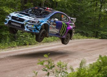 Ken Block jumping Subaru Impreza WRX rally car