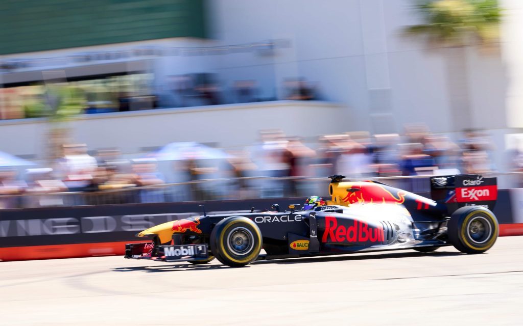 Red Bull Racing RB7 Formula 1 car driving on street