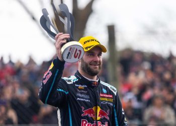 Shane van Gisbergen holding trophy at Supercars Pukekohe