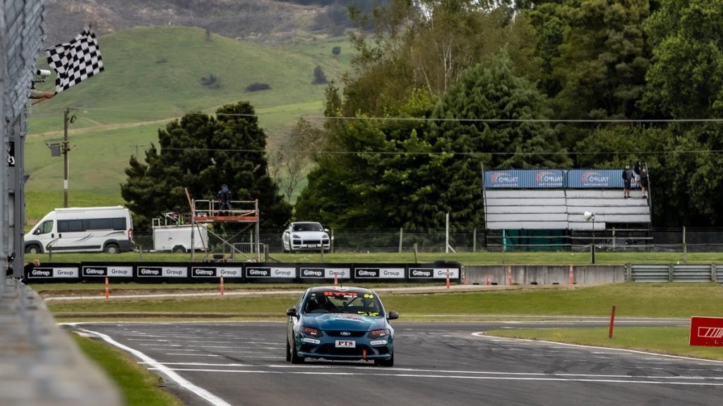 Brad Kroef crossing finish line in Ford Falcon V8 Ute