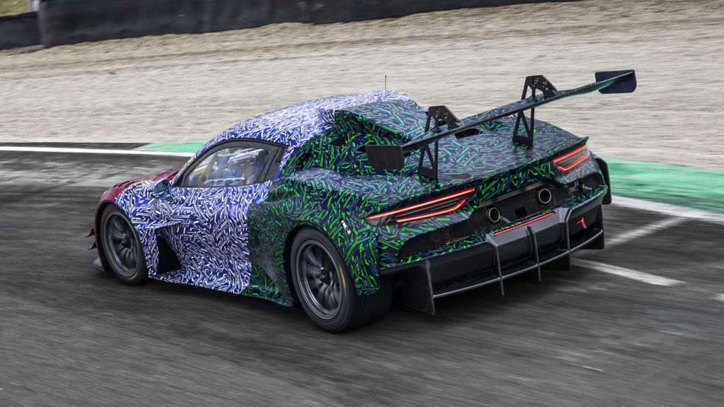 Maserati MC20 GT2 rear three quarter view on track