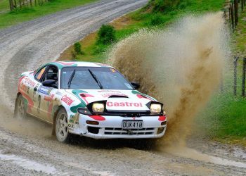 Toyota Celica GT-Four ST185 rally car driving through puddle