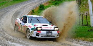Toyota Celica GT-Four ST185 rally car driving through puddle