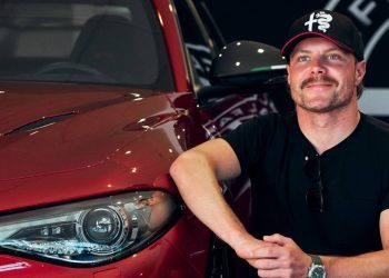 Alfa Romeo F1 Team driver kneeling next to his new Giulia GTAm