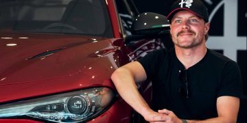 Alfa Romeo F1 Team driver kneeling next to his new Giulia GTAm