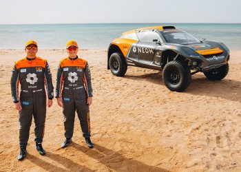 Tanner Foust and Emma Gilmour standing next to NEOM McLaren Extreme E car