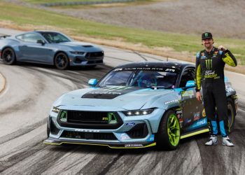 Vaughn Gittin Jr. standing with Formula Drift Ford Mustang