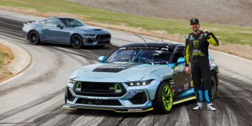 Vaughn Gittin Jr. standing with Formula Drift Ford Mustang