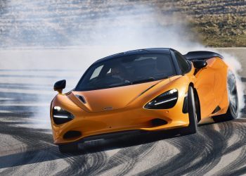 McLaren 750S drifting around corner on track