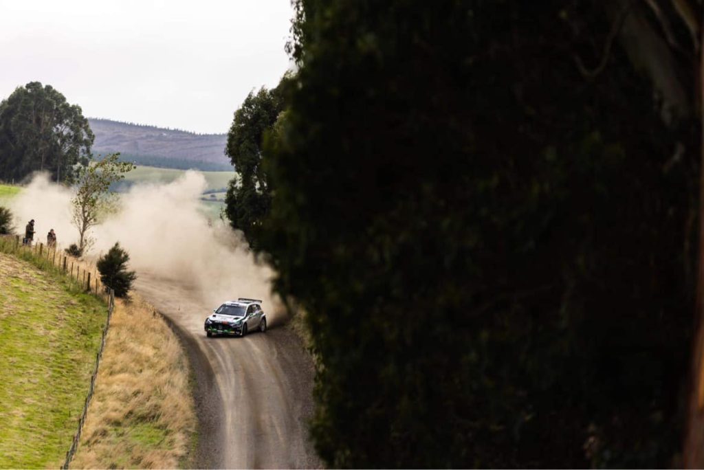 Hayden Paddon drifting Hyundai i20 N Rally2 car on dirt road