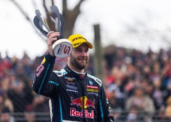 Shane van Gisbergen holding Pukekohe SuperSprint trophy