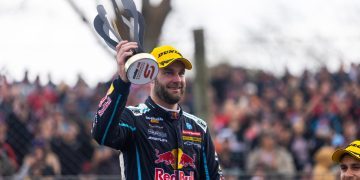 Shane van Gisbergen holding Pukekohe SuperSprint trophy