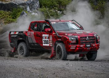 Mitsubishi Triton rally car drifting on gravel