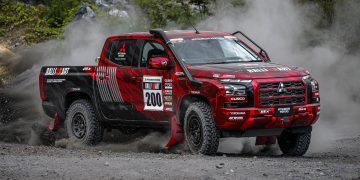 Mitsubishi Triton rally car drifting on gravel