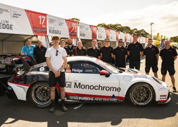 Callum Hedge and team standing with Porsche Carrera Cup car