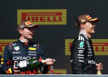 MONTREAL, QUEBEC - JUNE 15: Second placed Max Verstappen of the Netherlands and Oracle Red Bull Racing and Race winner George Russell of Great Britain and Mercedes AMG Petronas F1 Team celebrate on the podium with Champagne during the F1 Grand Prix of Canada at Circuit Gilles-Villeneuve on June 15, 2025 in Montreal, Quebec. (Photo by Mark Thompson/Getty Images) // Getty Images / Red Bull Content Pool // SI202506150773 // Usage for editorial use only //