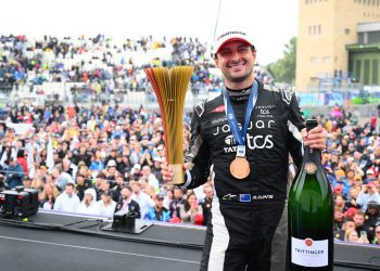 BERLIN, GERMANY - JULY 12: Race winner Mitch Evans of New Zealand and Jaguar TCS Racing celebrates on the podium during the Berlin E-Prix, Round 13 of the 2025 FIA Formula E World Championship at Tempelhof Airport Circuit on July 12, 2025 in Berlin, Germany. (Photo by Simon Galloway/LAT Images for Formula E)