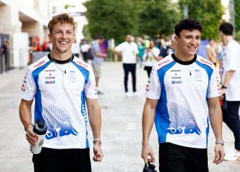 LUSAIL CITY, QATAR - NOVEMBER 28: Liam Lawson of New Zealand and Visa Cash App Racing Bulls and Isack Hadjar of France and Visa Cash App Racing Bulls walk in the Paddock during practice ahead of the F1 Grand Prix of Qatar at Lusail International Circuit on November 28, 2025 in Lusail City, Qatar. (Photo by Andrew Ferraro/LAT Images) // Getty Images / Red Bull Content Pool // SI202511280533 // Usage for editorial use only //