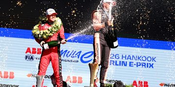 BERLIN, GERMANY - MAY 02: Second placed Nick Cassidy of New Zealand and Citroen Racing celebrates with Race winner Nico Muller of Switzerland and Porsche Formula E Team on the podium during the Berlin E-Prix, Round 7 of the 2026 FIA Formula E World Championship at Tempelhof Airport Circuit on May 02, 2026 in Berlin, Germany. (Photo by Simon Galloway/LAT Images)