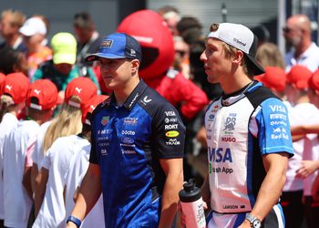 BUDAPEST, HUNGARY - JULY 26: Isack Hadjar of France and Oracle Red Bull Racing and Liam Lawson of New Zealand and Visa Cash App Racing Bulls talk on the drivers parade prior to the F1 Grand Prix of Hungary at Hungaroring on July 26, 2026 in Budapest, Hungary. (Photo by Sam Bloxham/LAT Images) // Getty Images / Red Bull Content Pool // SI202607260192 // Usage for editorial use only //