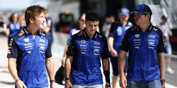 MADRID, SPAIN - SEPTEMBER 10: Max Verstappen of the Netherlands and Oracle Red Bull Racing, Isack Hadjar of France and Oracle Red Bull Racing, and Liam Lawson of New Zealand and Oracle Red Bull Racing talk as they walk in the Pitlane during previews ahead of the F1 Grand Prix of Spain at Madring on September 10, 2026 in Madrid, Spain. (Photo by Mark Thompson/Getty Images) // Getty Images / Red Bull Content Pool // SI202609100467 // Usage for editorial use only //